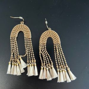 Gold rainbow earrings with white tassels